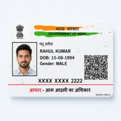 Water-resistant masked Aadhaar PVC card print with visible fictional date of birth